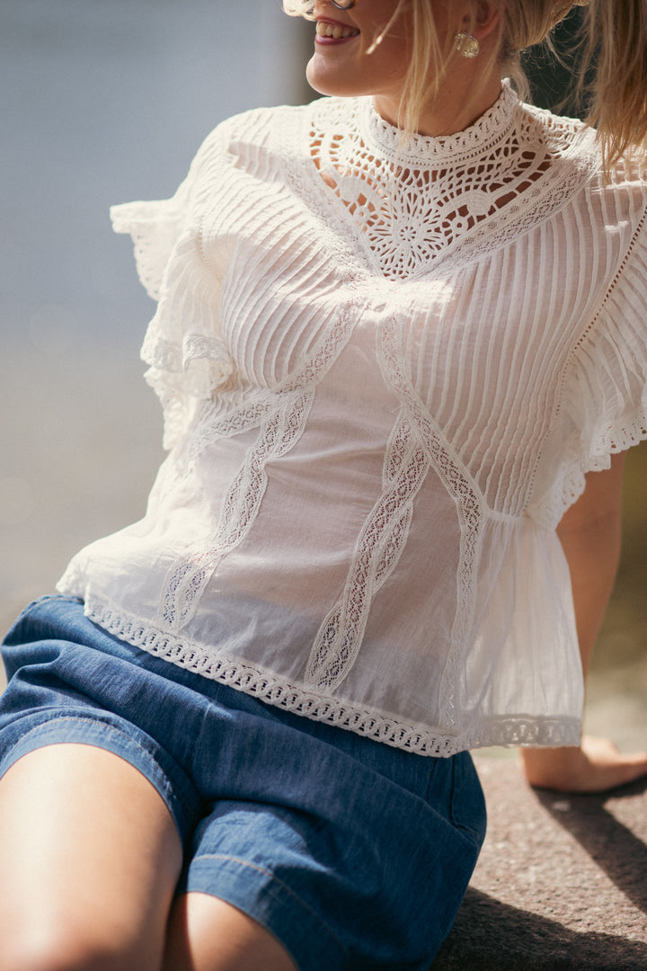 OFF-WHITE BLOUSE WITH APPLIQUES