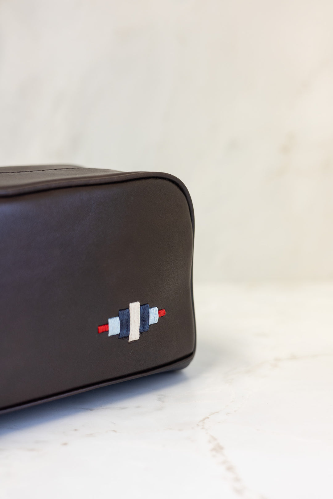 Hombre washbag - brown leather with multi stitching