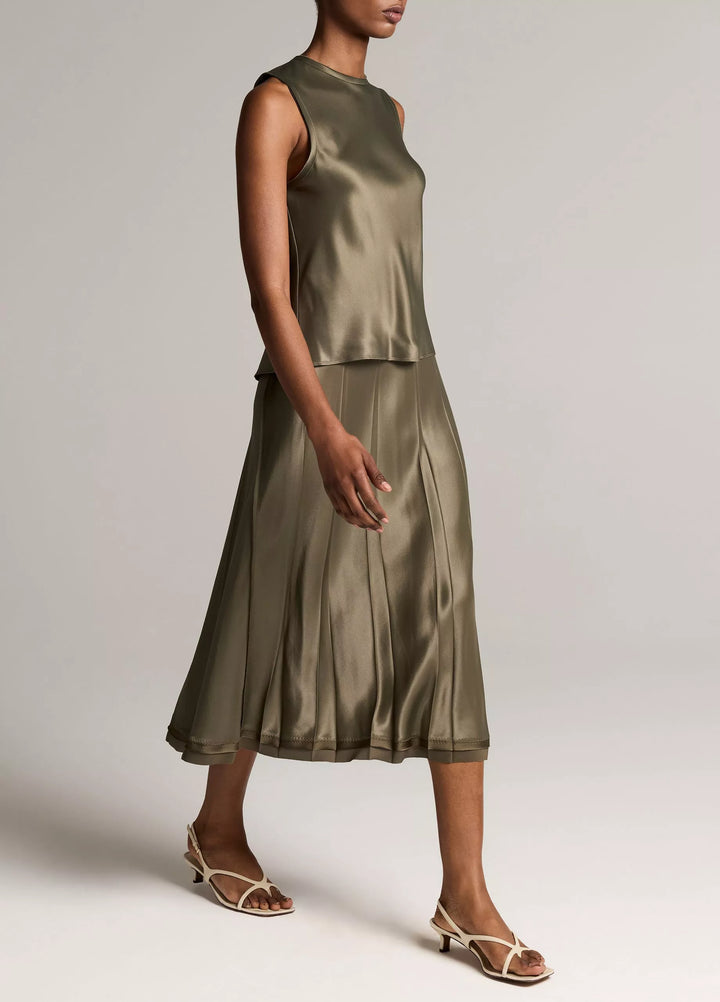 CREASED PLEATED SKIRT W/ RAW EDGE HEM