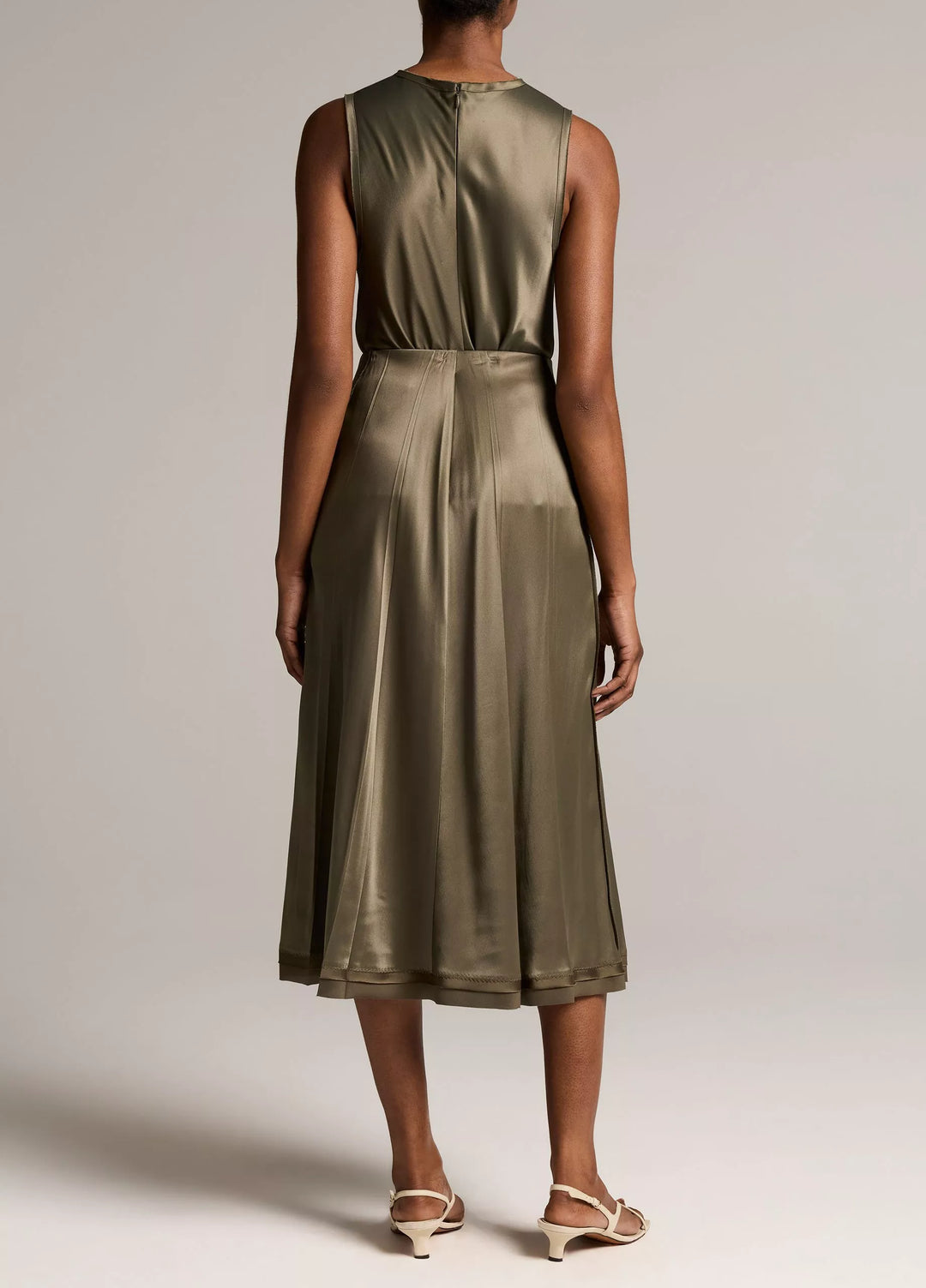 CREASED PLEATED SKIRT W/ RAW EDGE HEM