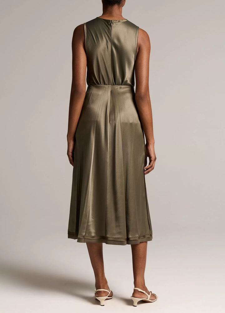CREASED PLEATED SKIRT W/ RAW EDGE HEM