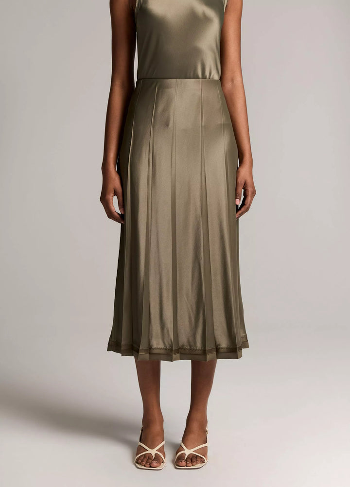 CREASED PLEATED SKIRT W/ RAW EDGE HEM